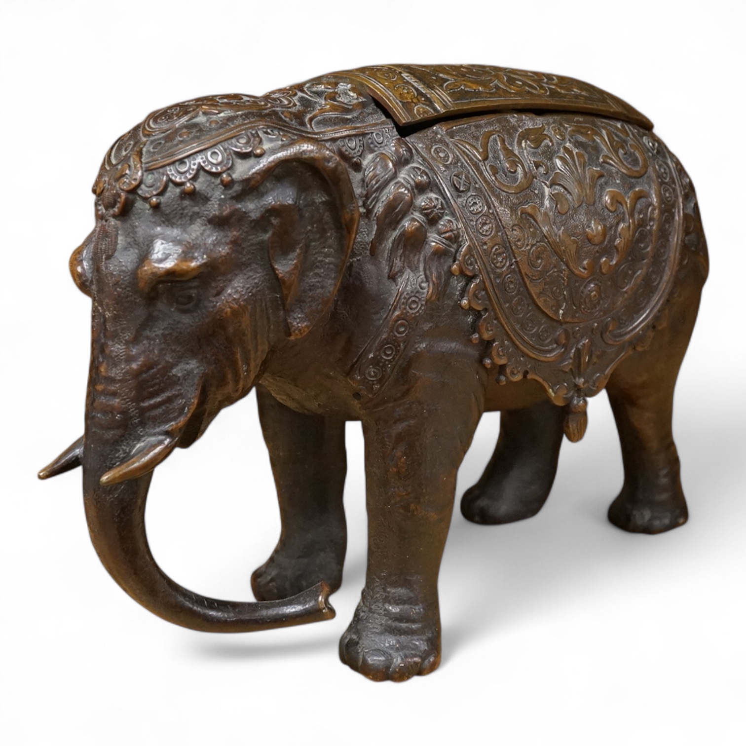 A novelty late 19th/early 20th century bronze inkwell in the form of an Indian elephant, 27cm wide